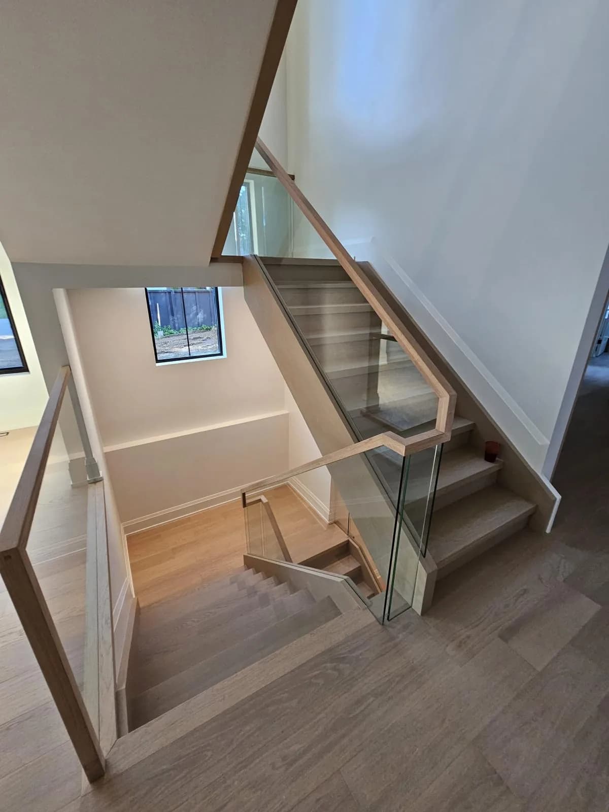 Floating Oak & Glass Staircase — Windsor — Wooden Stringer / White Oak Treads / Frameless Glass Railing custom staircase